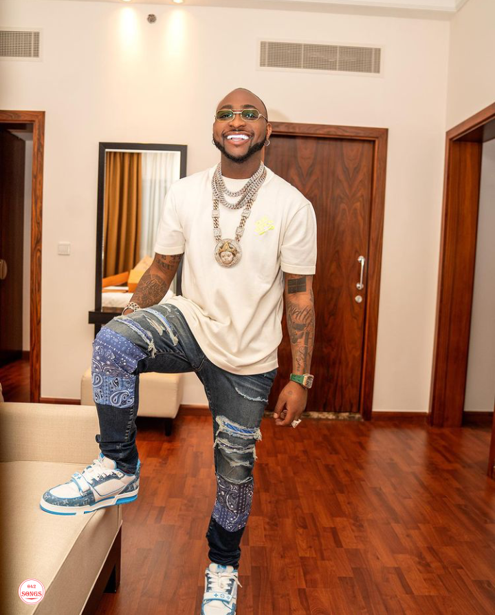 Davido stirs unrest as he sprays money randomly for fans while cruising in his Lamborghini